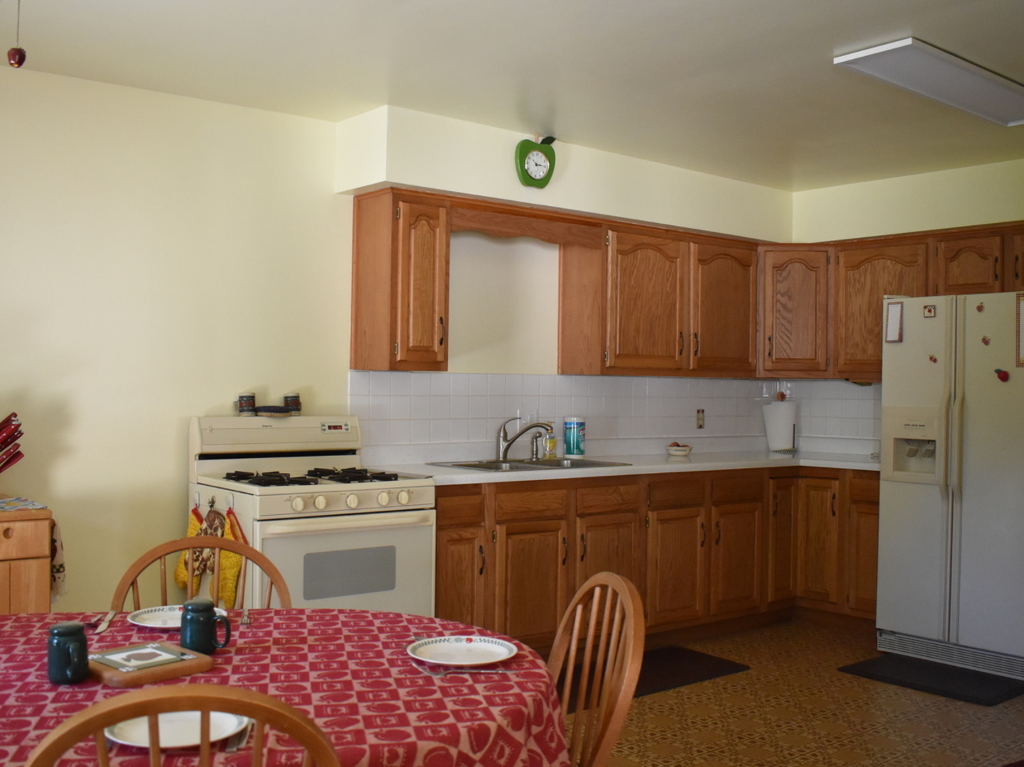 2845 River Road Kankakee, IL 60901 - Photo 15 of 26 a kitchen with stainless steel appliances granite countertop a stove a sink dishwasher and cabinets with wooden floor