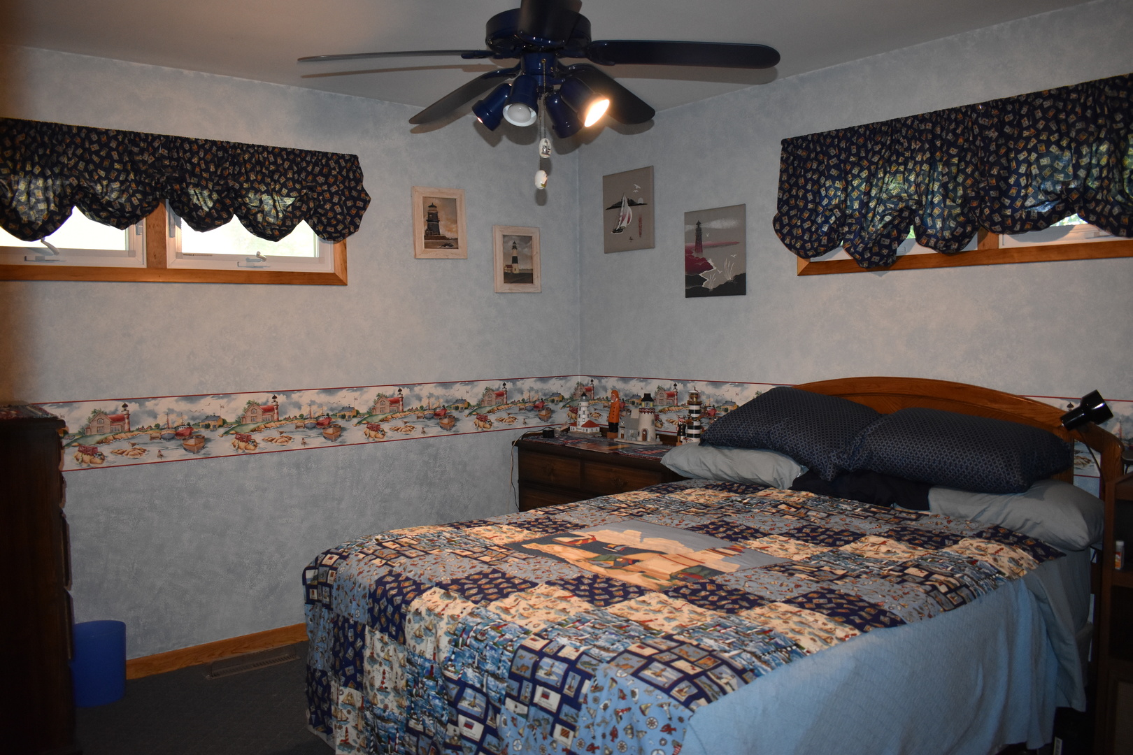 2845 River Road Kankakee, IL 60901 - Photo 21 of 26 a bed sitting in a bedroom next to a lamp