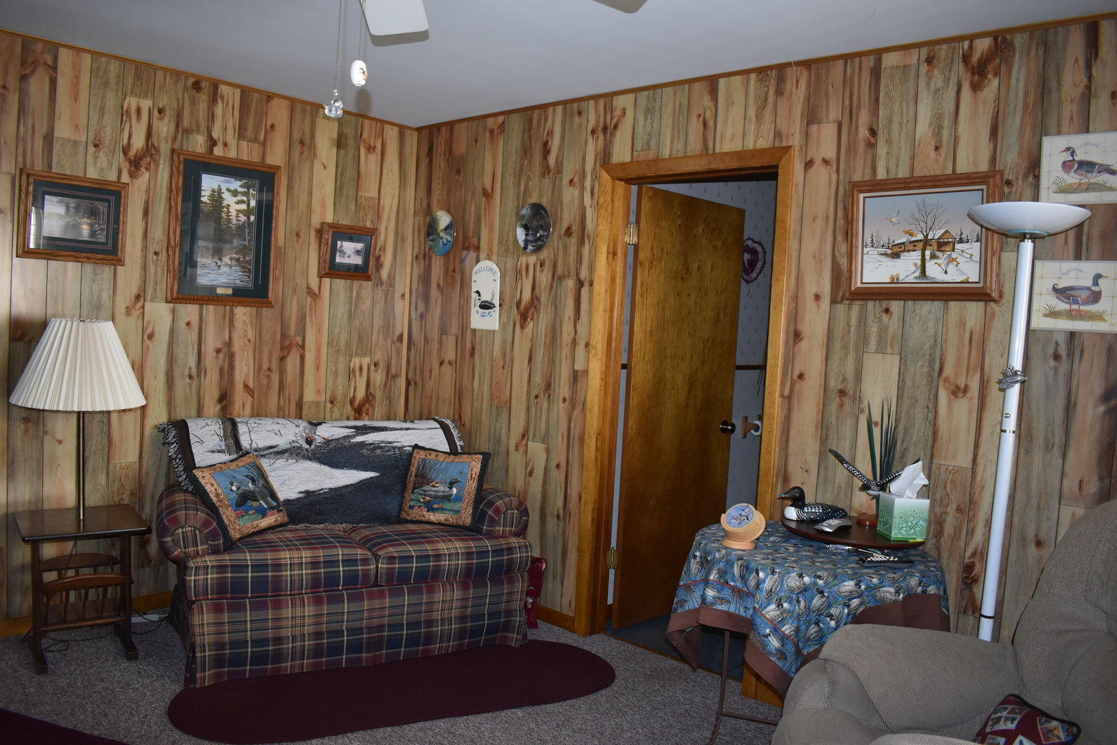 2845 River Road Kankakee, IL 60901 - Photo 22 of 26 a bedroom with a bed and a chandelier