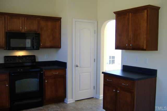 2604 Dutchman Creek Raleigh, NC 27610 - Photo 3 of 7 Beautiful kitchen with upgraded maple cabinets, smooth top range, microwave & dishwasher along with recessed lighting Other
