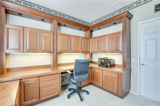 a bathroom with a granite countertop sink a toilet and a shower