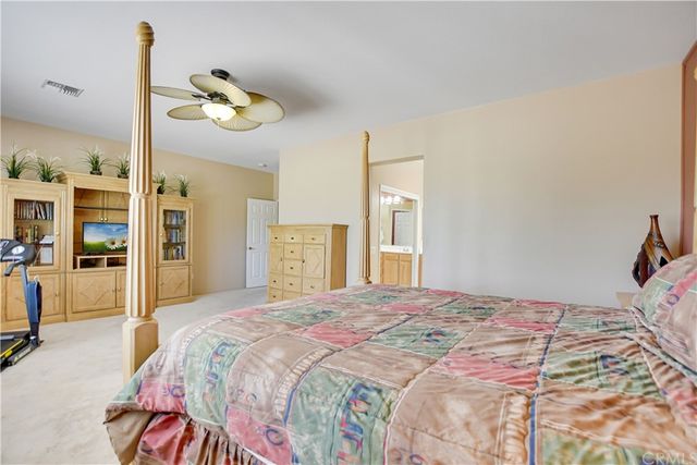 a view of a house with backyard and porch