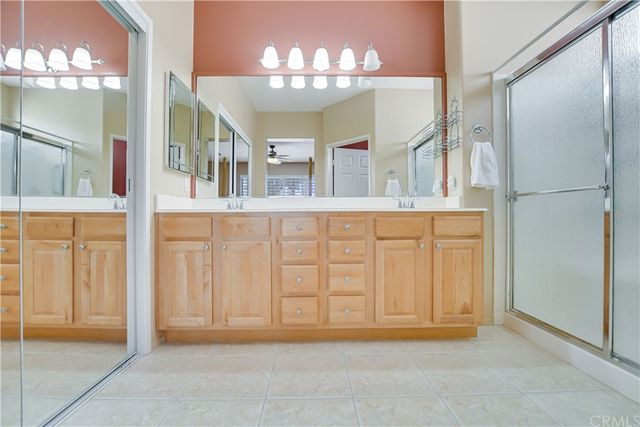 a view of a house with a yard and potted plants