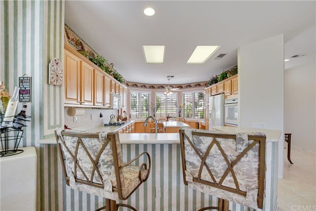 a kitchen with a sink stove and microwave