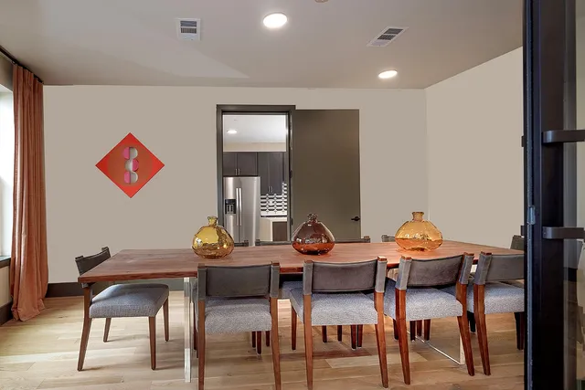 a front view of a building with a garden