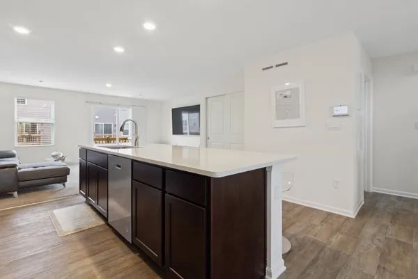 a kitchen with a sink and cabinets