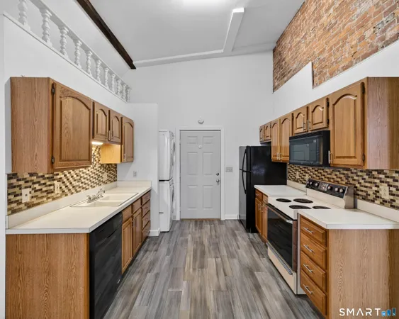 a view of a hallway with washer and dryer