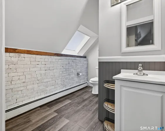 an empty room with fireplace and windows
