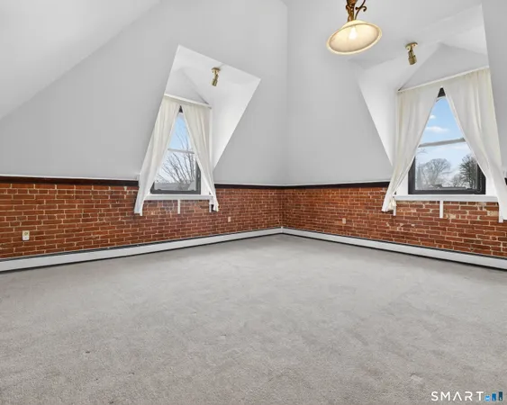 a view of an empty room with windows