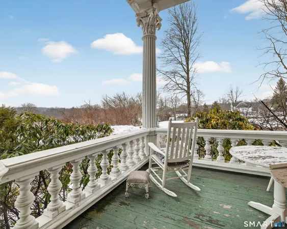 an aerial view of a house with a yard basket ball court and outdoor seating