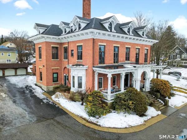 a view of a water fountain in front of a house
