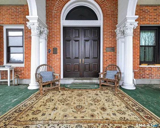 a swimming pool with outdoor seating
