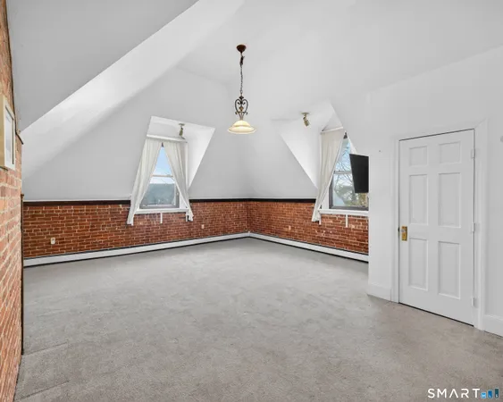 a view of empty room with a flat screen tv