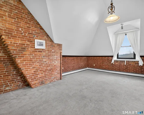 a kitchen with stainless steel appliances a stove a sink and a refrigerator