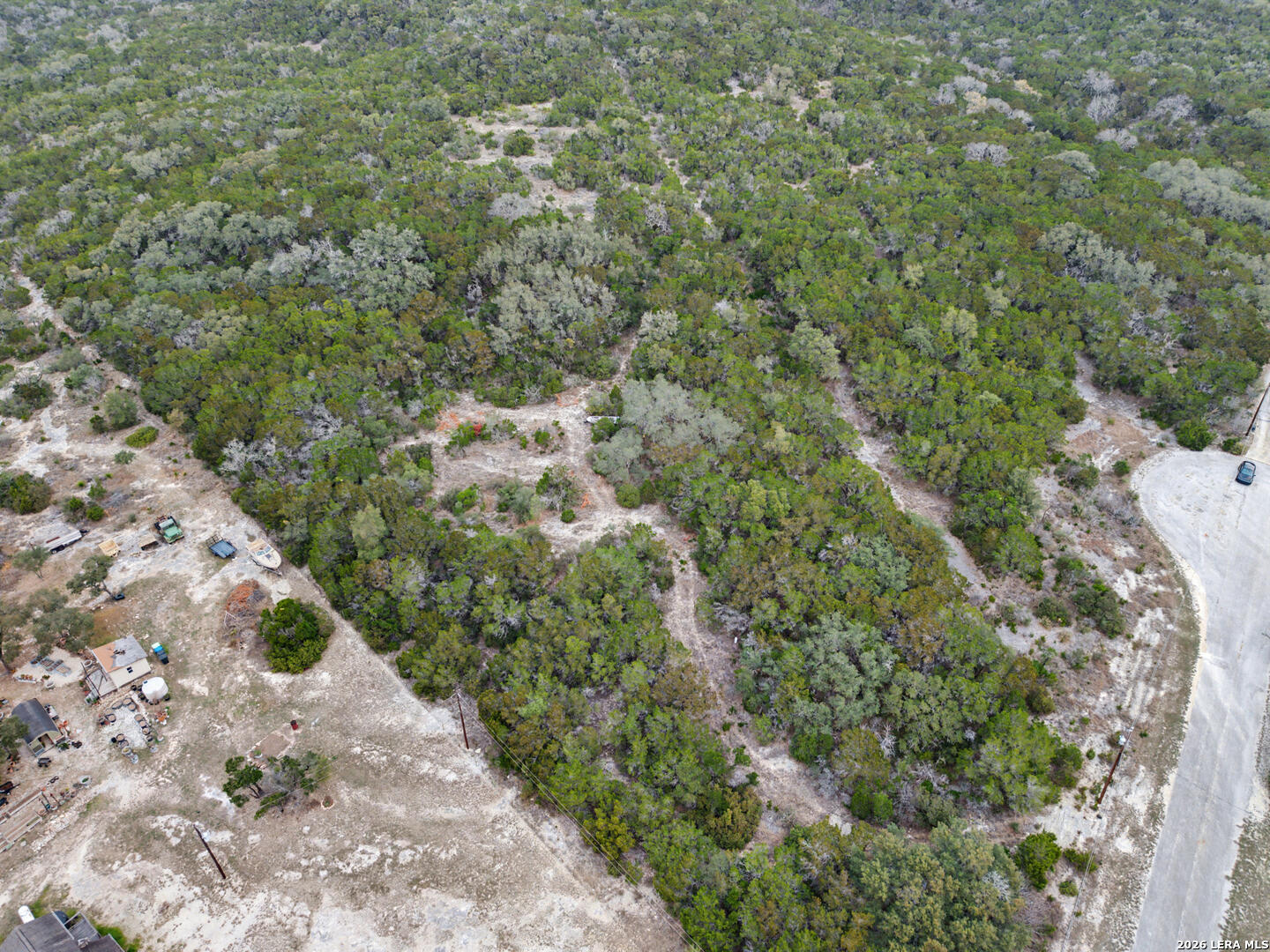 175 County Road 2765 Mico, TX 78056 - Photo 9 of 15 a view of a large yard with lots of bushes