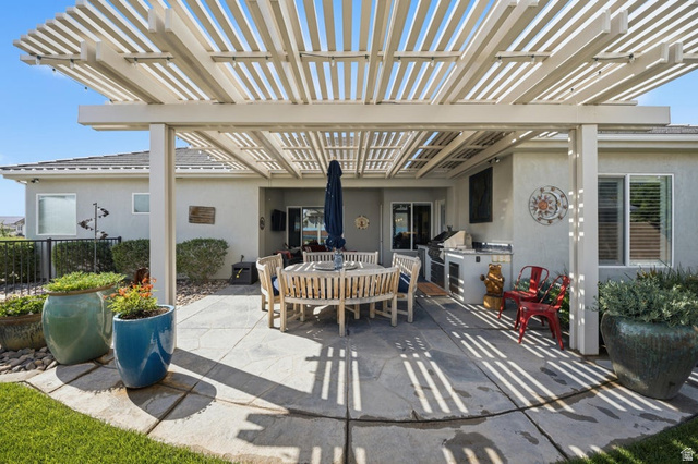 2829 East 1880th Street South St. George, UT 84790 - Photo 35 of 54 View of patio / terrace featuring a pergola and an outdoor kitchen / dining area