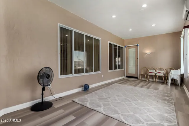 a view of workspace filled with furniture and windows