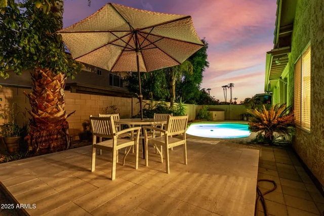 a view of a swimming pool with a patio