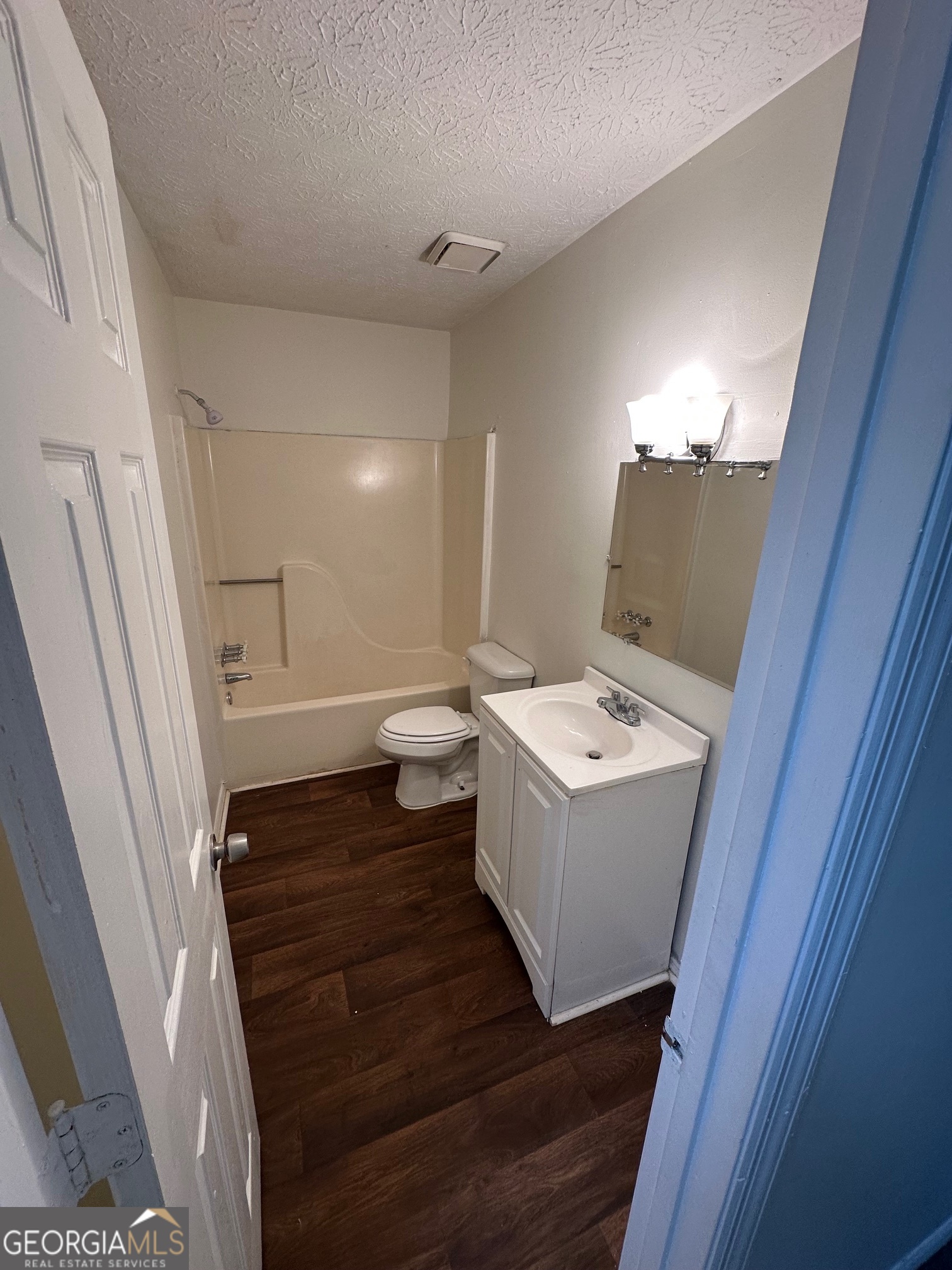 2511 Pine Tree Trail South Fulton, GA 30349 - Photo 15 of 23 a bathroom with a sink a toilet and a mirror
