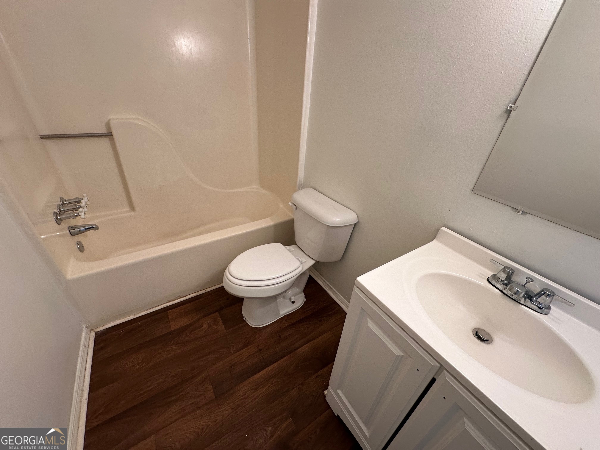 2511 Pine Tree Trail South Fulton, GA 30349 - Photo 16 of 23 a bathroom with a sink toilet a mirror and shower