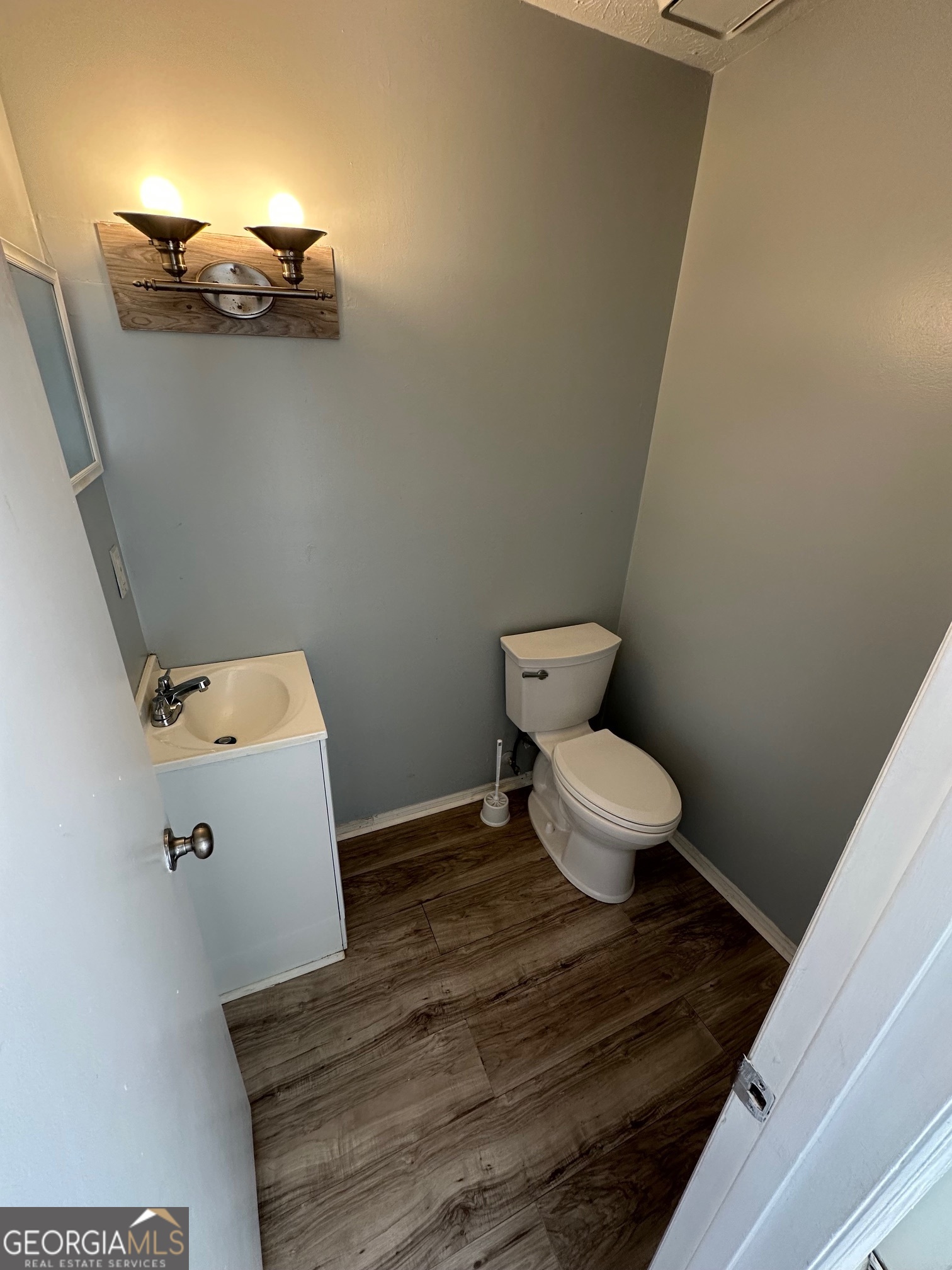 2511 Pine Tree Trail South Fulton, GA 30349 - Photo 3 of 23 a white toilet sitting next to a bathroom sink