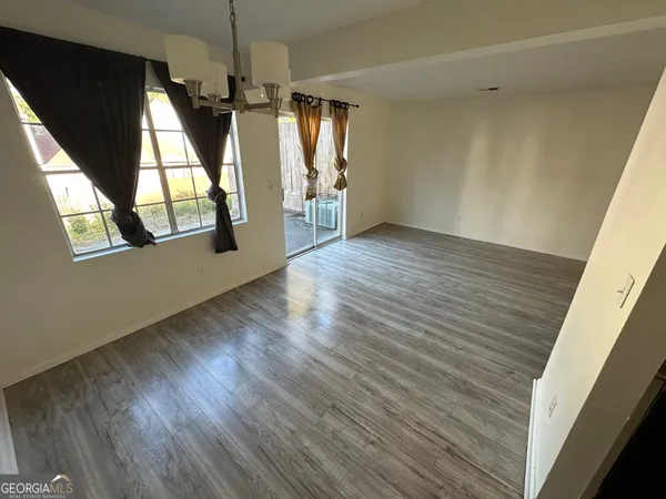 a kitchen with a refrigerator sink and stove