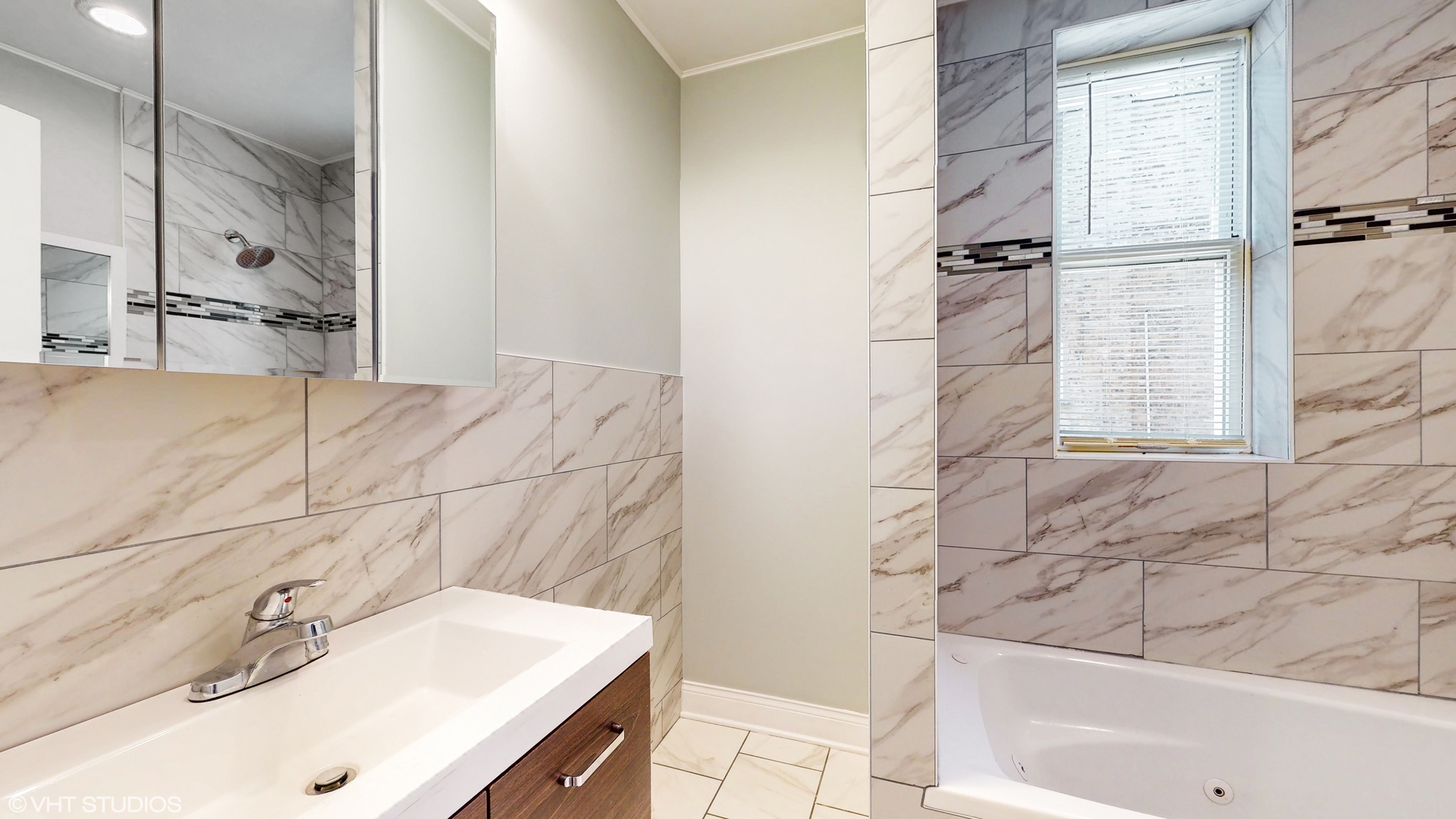 7316 South Peoria Street Chicago, IL 60621 - Photo 12 of 40 a bathroom with a sink and a bathtub