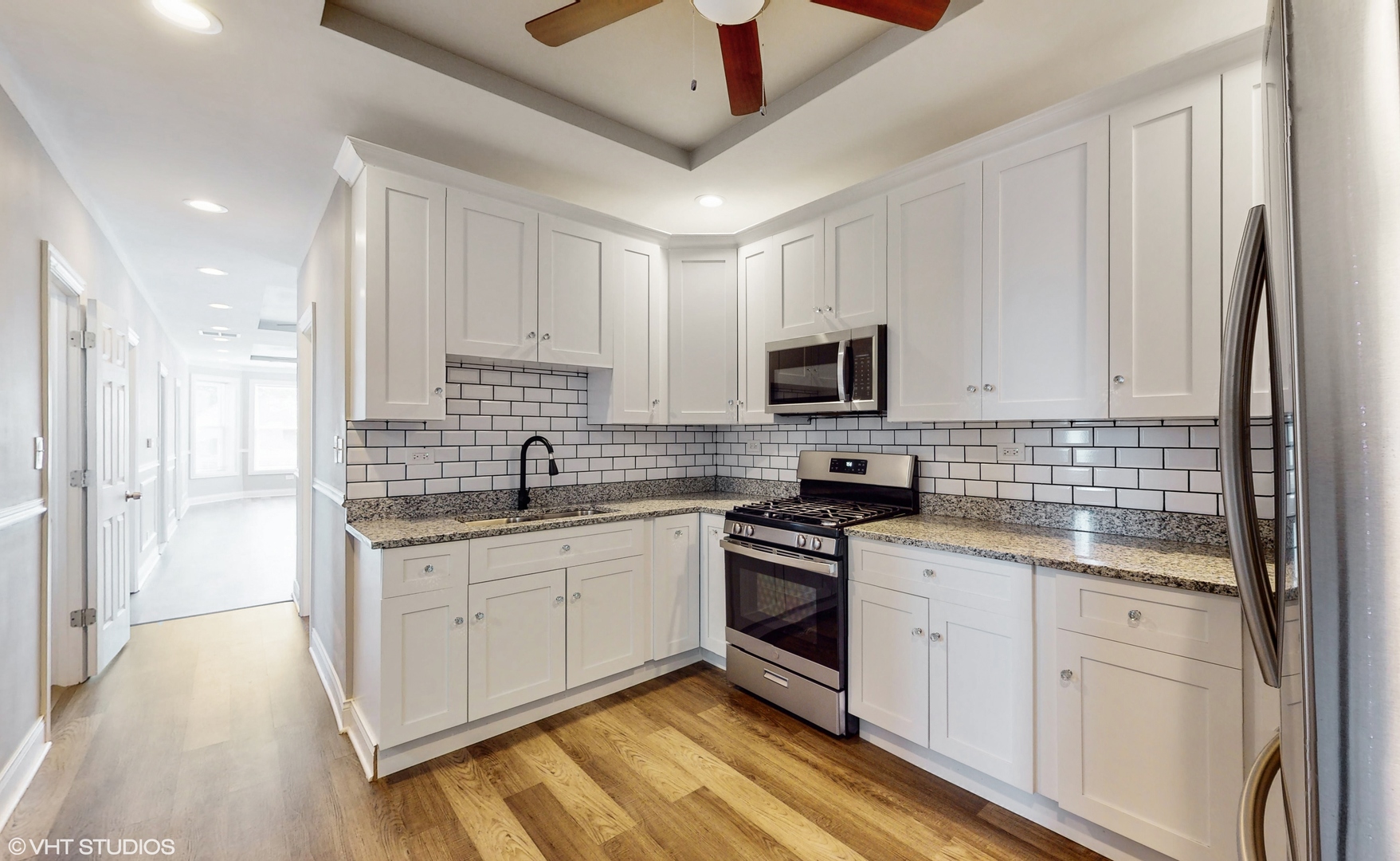7316 South Peoria Street Chicago, IL 60621 - Photo 15 of 40 a kitchen with stainless steel appliances granite countertop a sink and cabinets