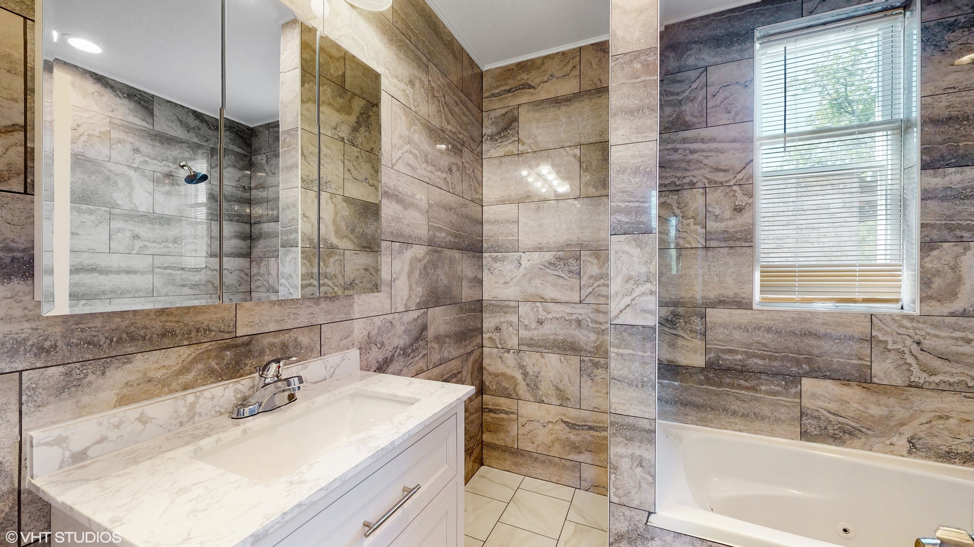 7316 South Peoria Street Chicago, IL 60621 - Photo 20 of 40 a bathroom with a sink mirror and a bathtub