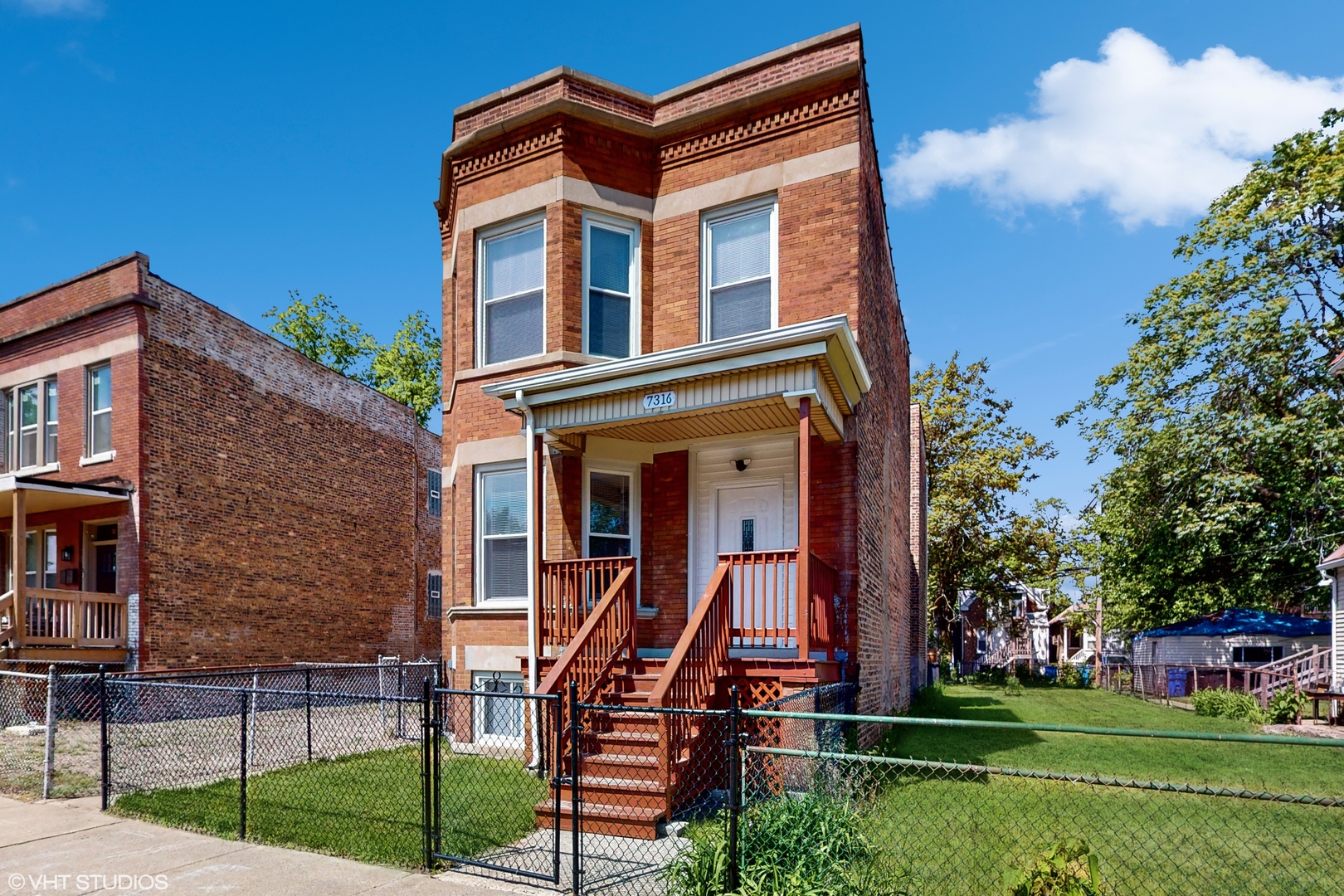 7316 South Peoria Street Chicago, IL 60621 - Photo 2 of 40 a view of a building with a yard
