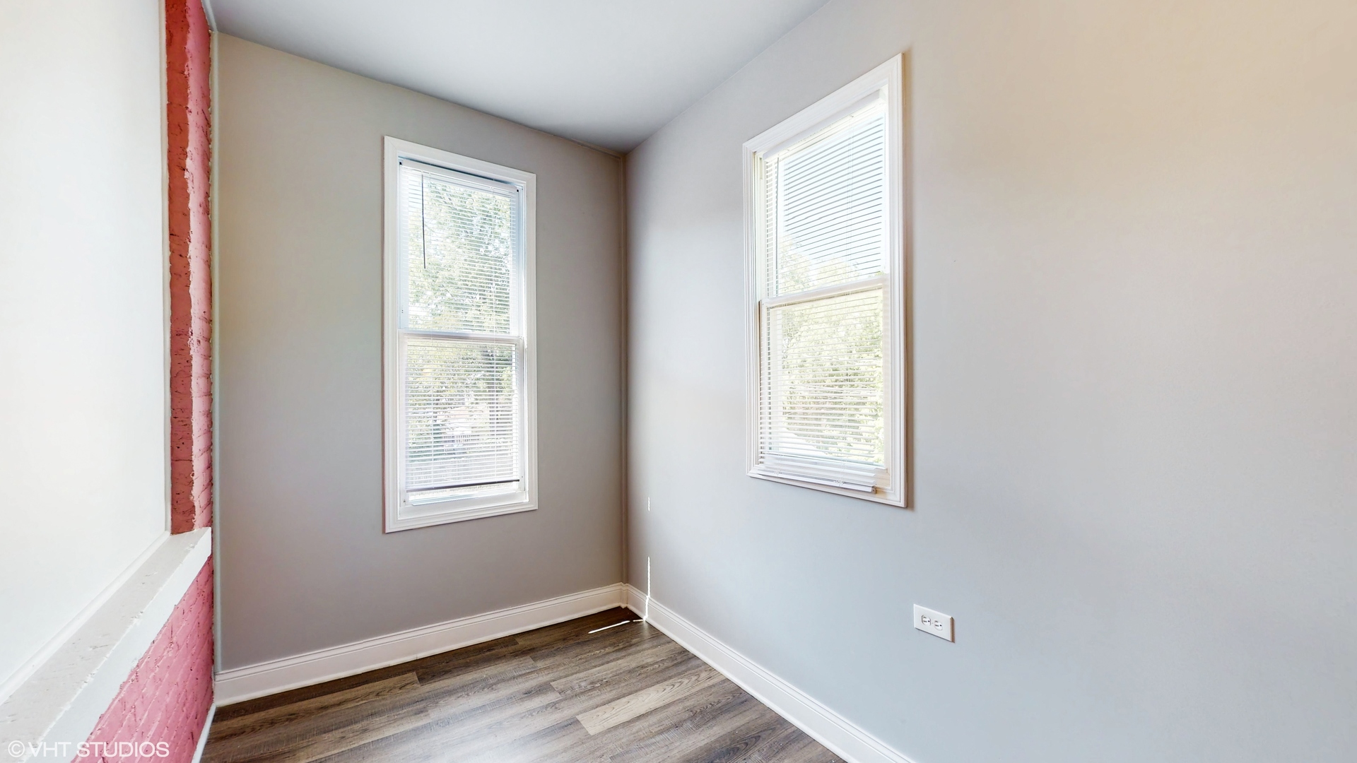 7316 South Peoria Street Chicago, IL 60621 - Photo 23 of 40 an empty room with wooden floor and windows
