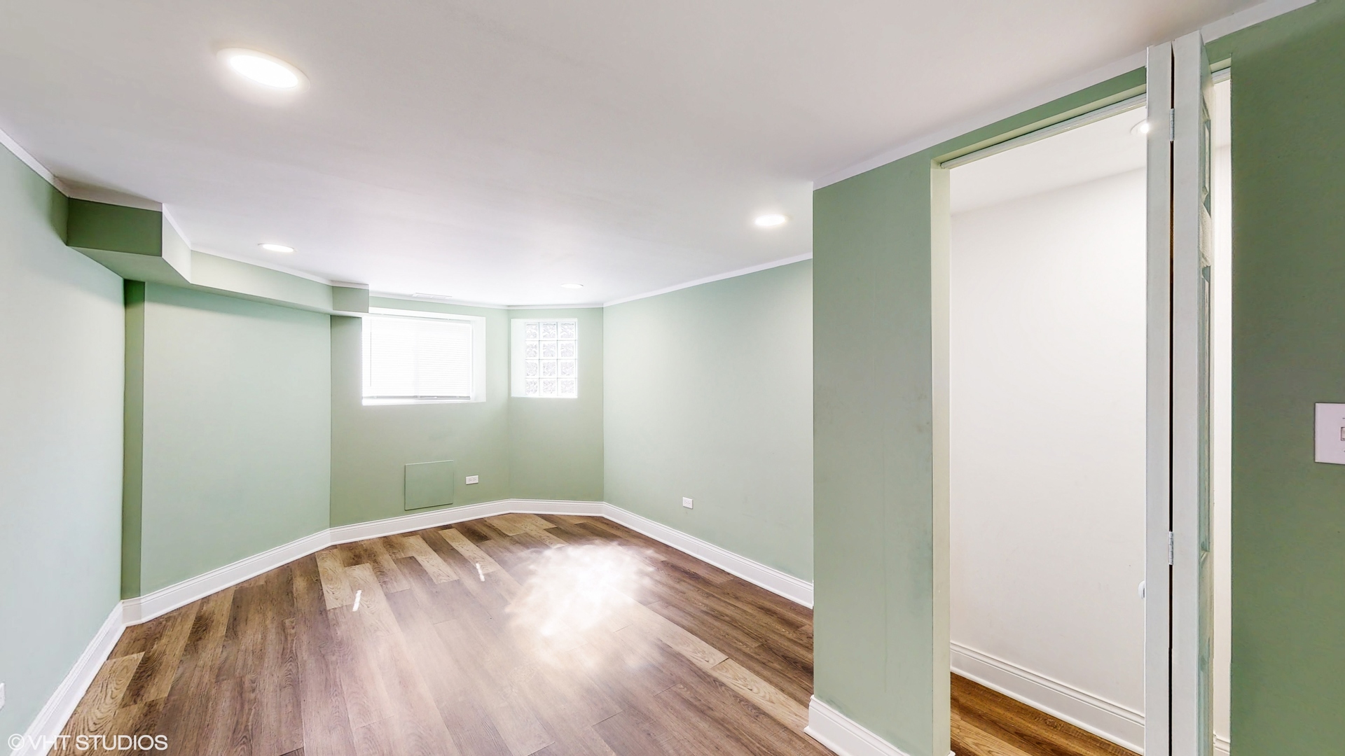 7316 South Peoria Street Chicago, IL 60621 - Photo 26 of 40 a view of empty room with wooden floor