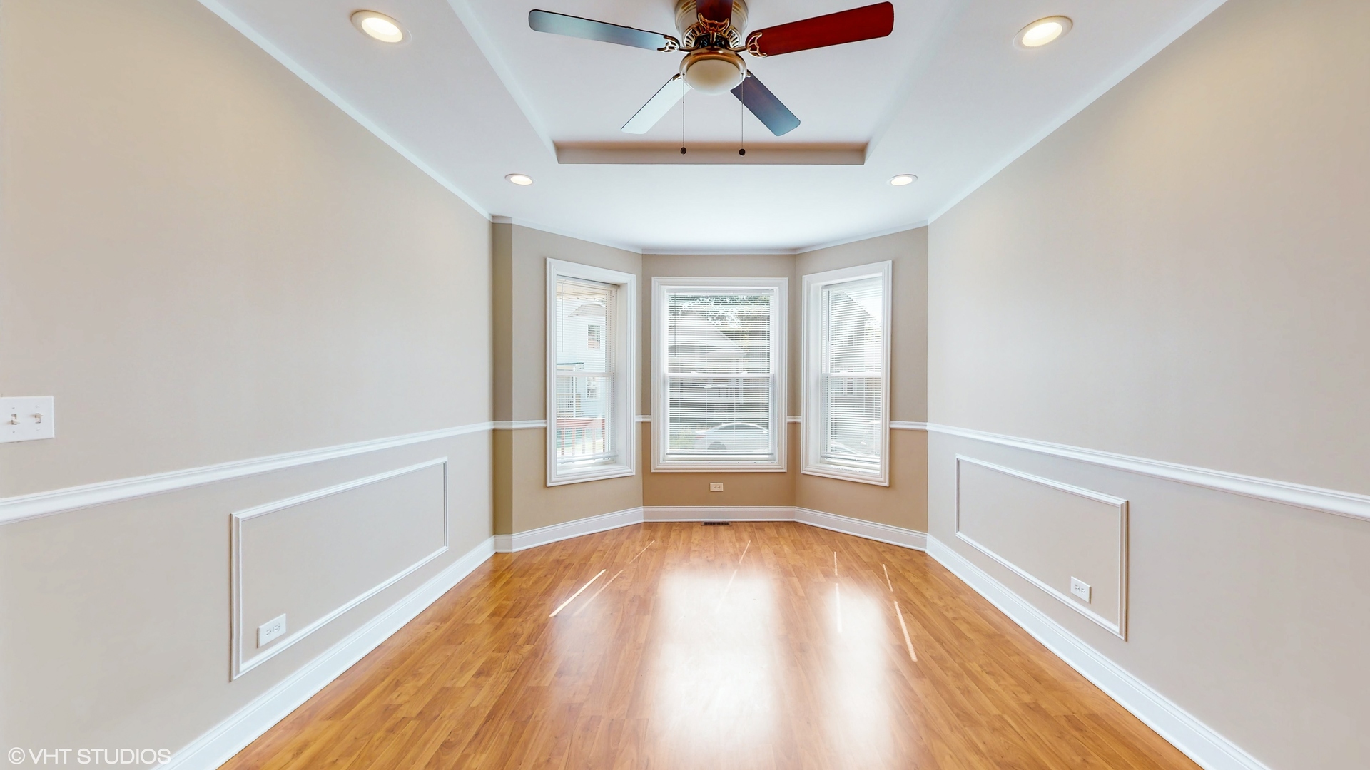 7316 South Peoria Street Chicago, IL 60621 - Photo 3 of 40 a view of an empty room with a window and wooden floor