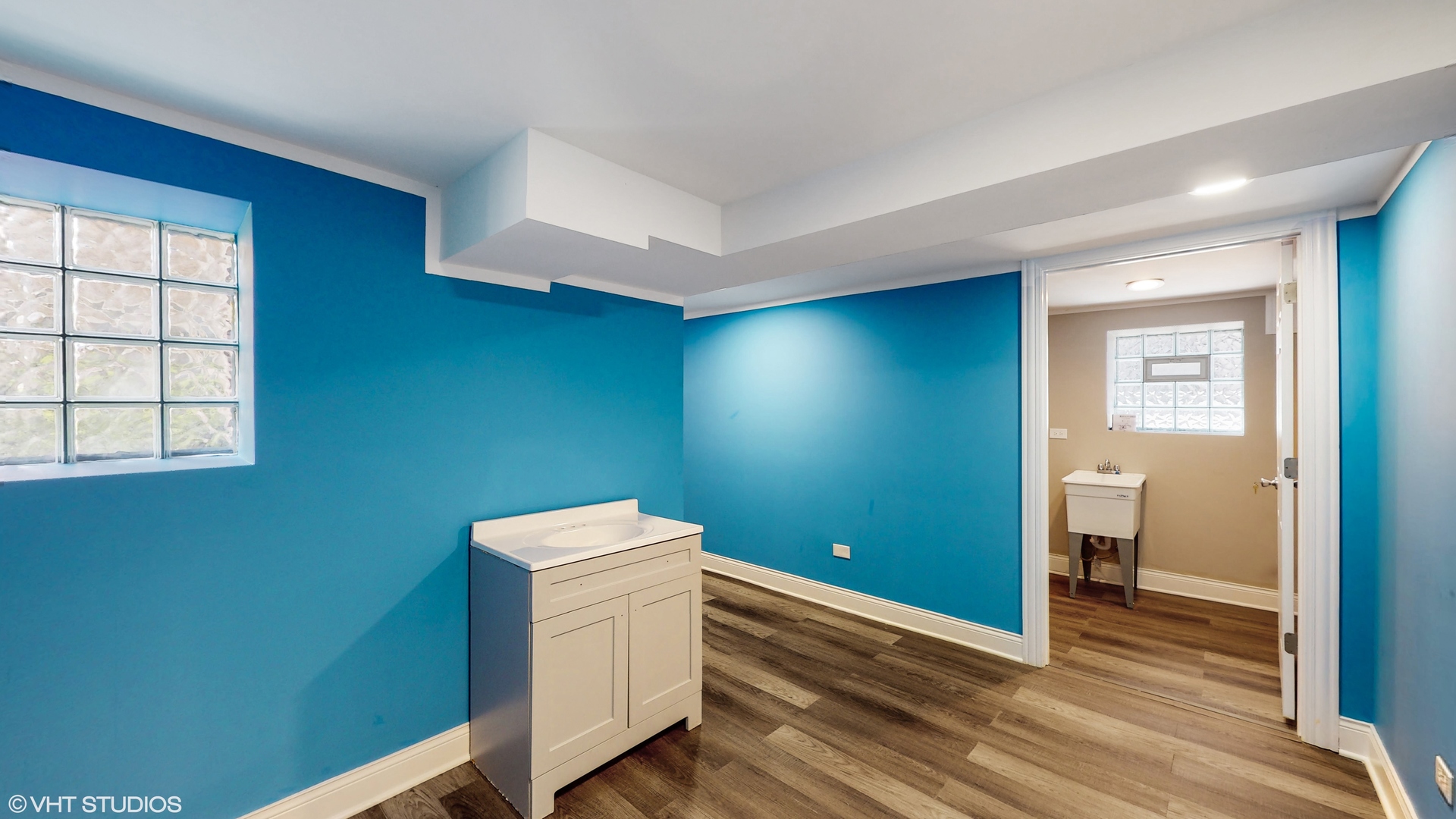 7316 South Peoria Street Chicago, IL 60621 - Photo 31 of 40 a view of a room with wooden floor and white walls