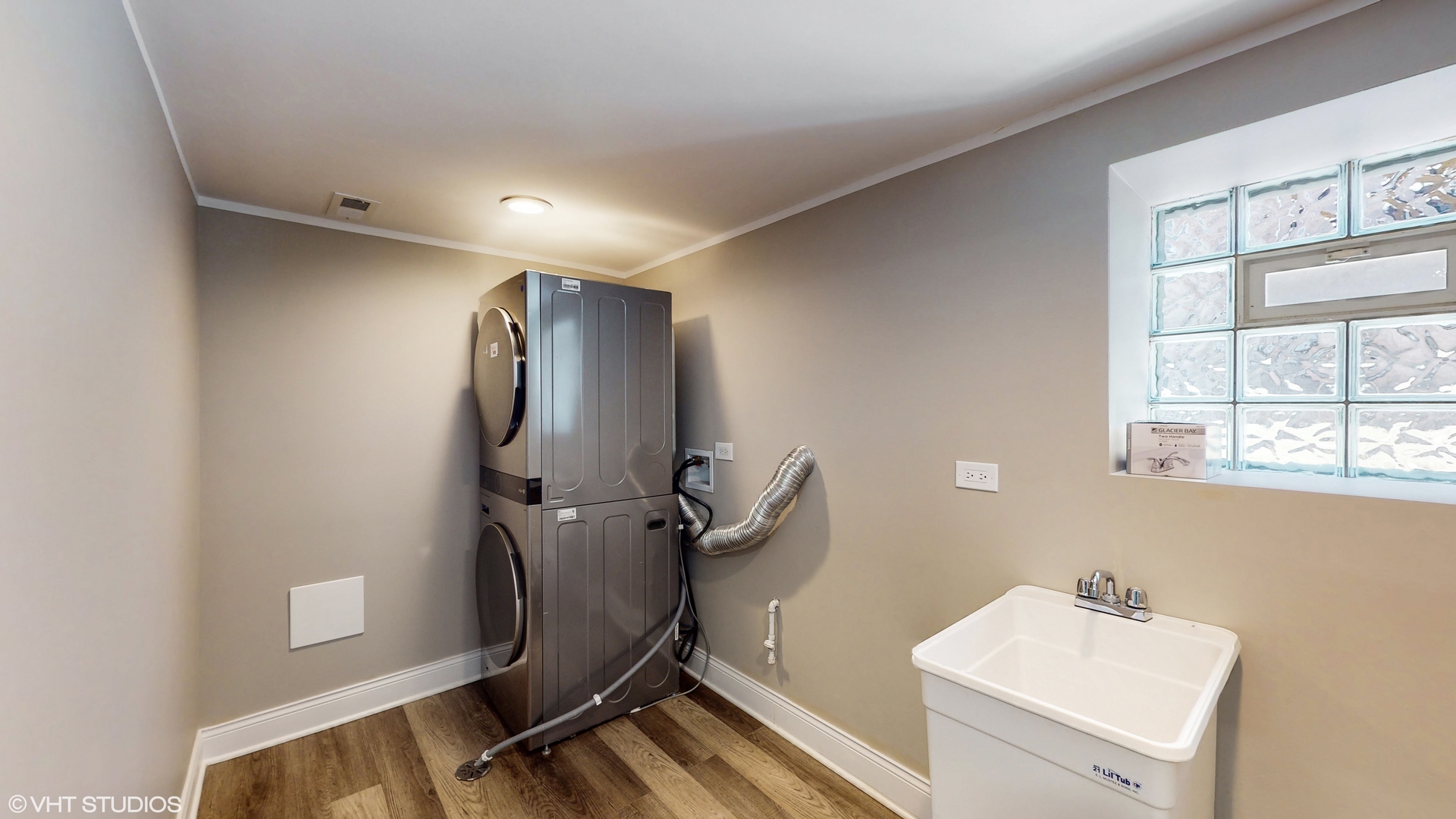 7316 South Peoria Street Chicago, IL 60621 - Photo 32 of 40 a bathroom with a sink mirror and a window