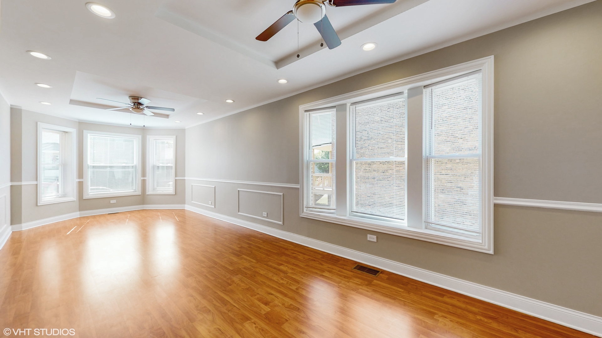 7316 South Peoria Street Chicago, IL 60621 - Photo 5 of 40 a view of an empty room with a window and wooden floor