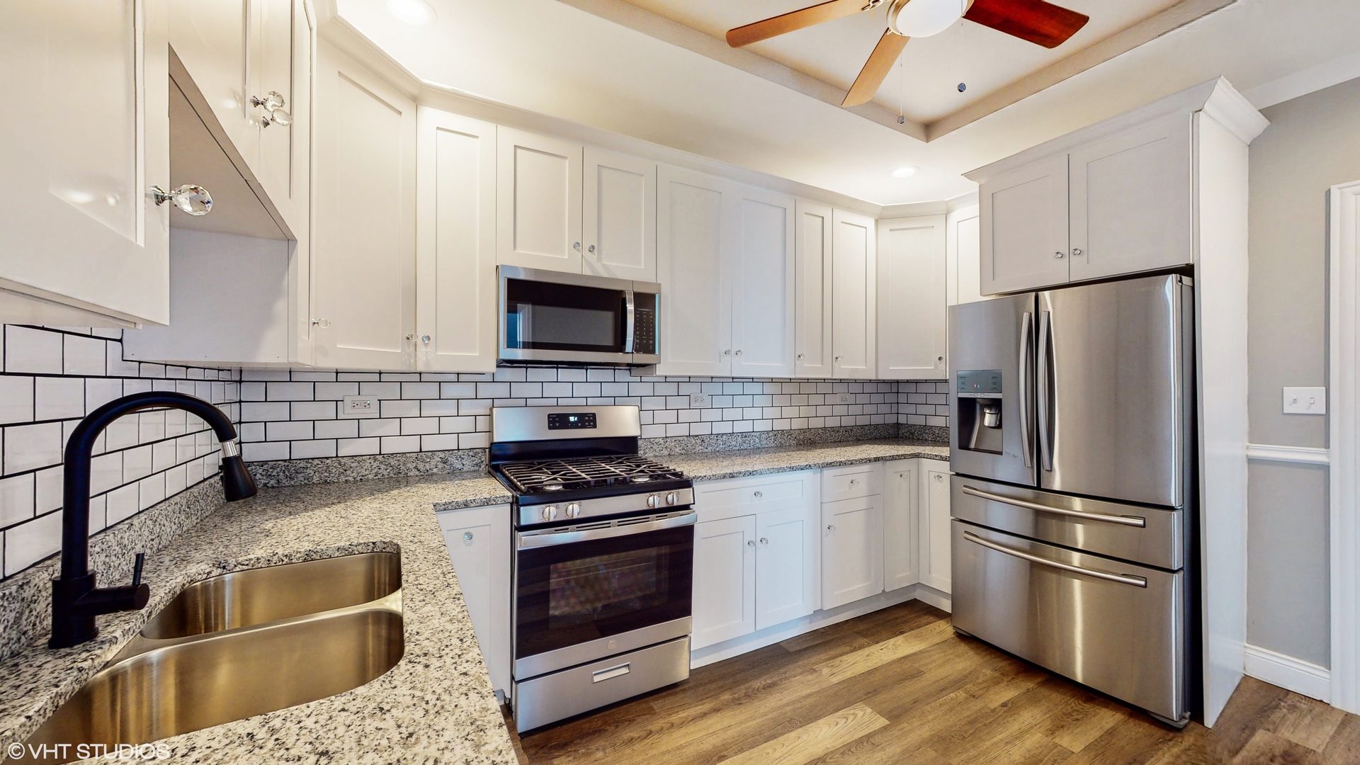 7316 South Peoria Street Chicago, IL 60621 - Photo 6 of 40 a kitchen with stainless steel appliances granite countertop a refrigerator sink and stove