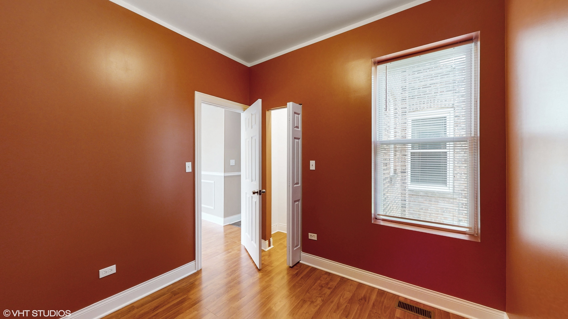 7316 South Peoria Street Chicago, IL 60621 - Photo 8 of 40 an empty room with wooden floor and windows