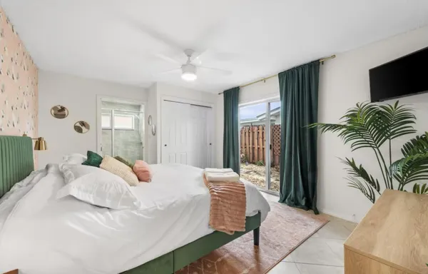 a bedroom with furniture and a wooden floor