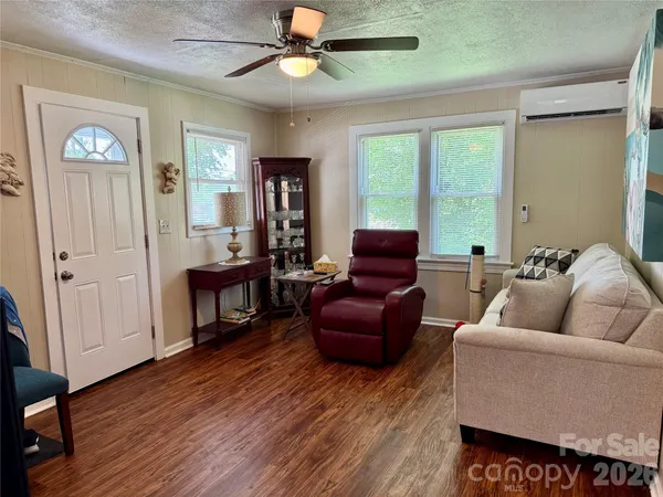 a living room with furniture and a window