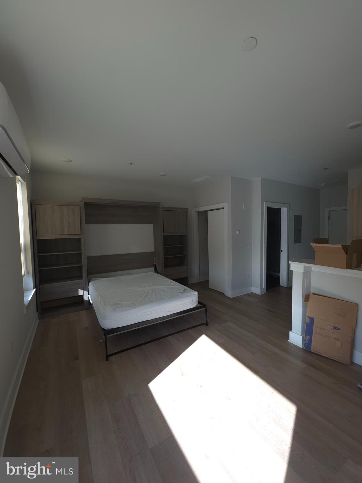 3503 Midvale Avenue, Unit 503 Philadelphia, PA 19129 - Photo 26 of 29 a living room with furniture and a flat screen tv