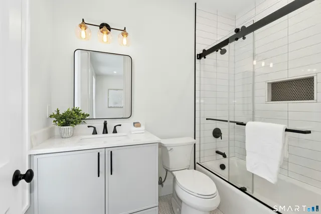 a kitchen with cabinets and window