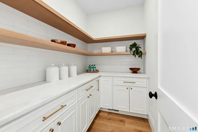 a bathroom with a tub and a mirror