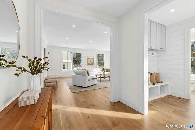 a living room with furniture and a table