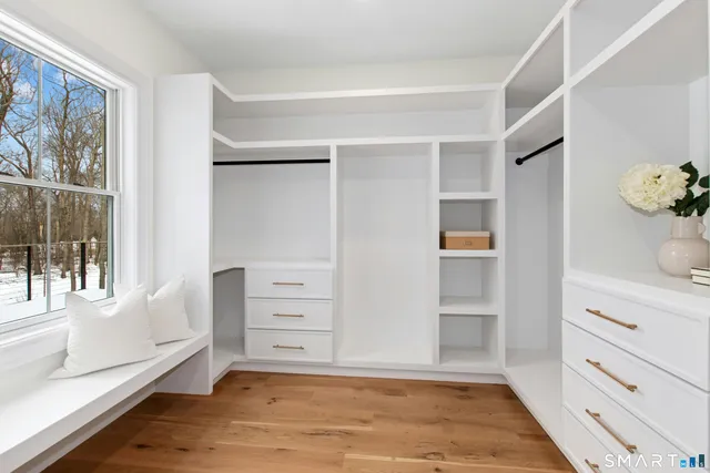 a bathroom with a mirror a sink and a shower