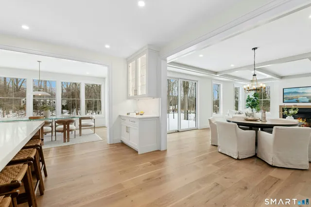 a view of kitchen with furniture and wooden floor