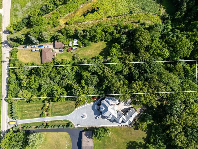 an aerial view of a house with a garden