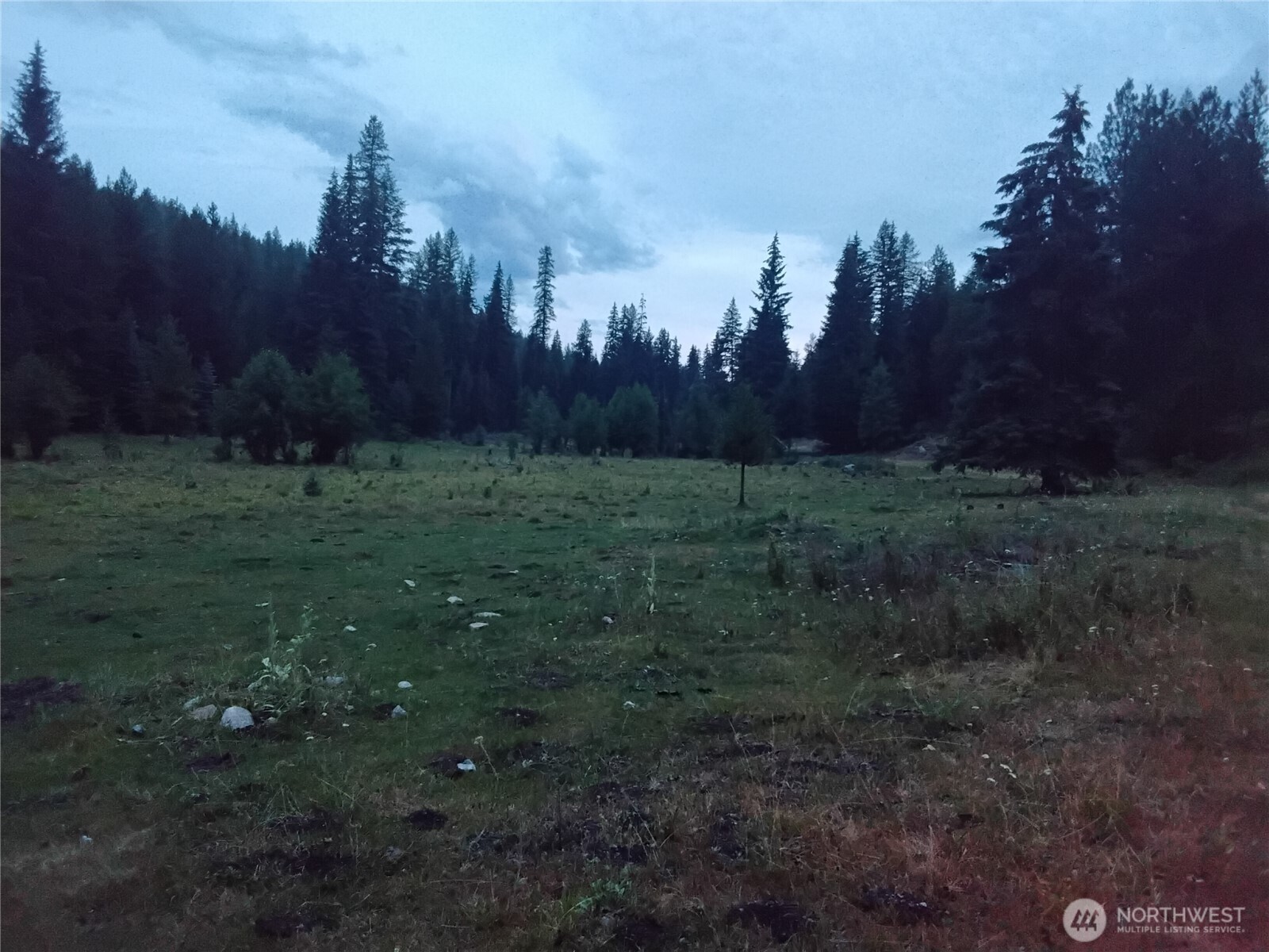 0 Little Place Road Tonasket, WA 98855 - Photo 11 of 23 a big yard with lots of green space and wooden fence