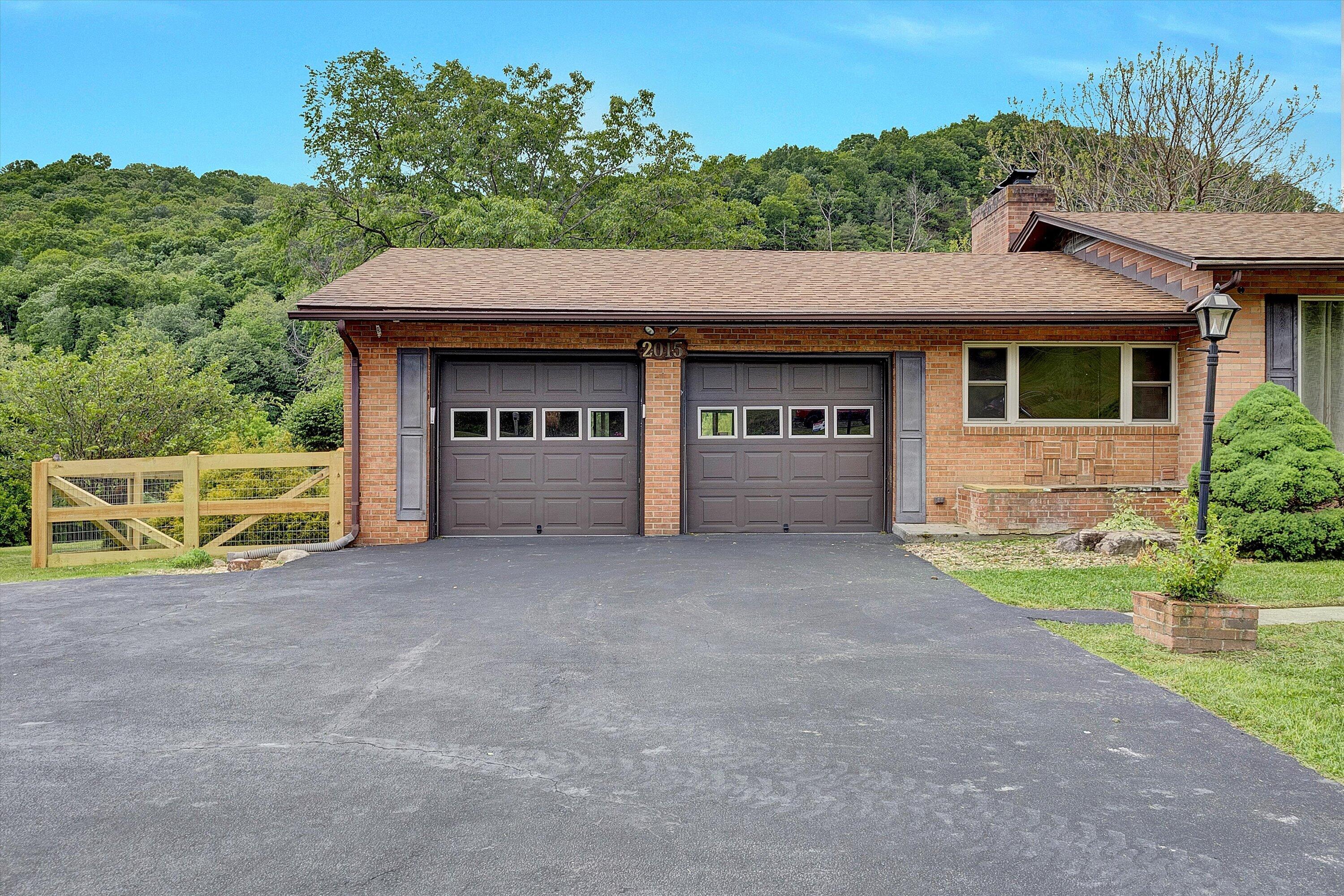 2015 Evergreen Road Covington, VA 24426 - Photo 4 of 46 a view of house with backyard and a garden