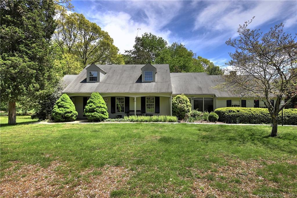 521 Ridge Road Orange, CT 06477 - Photo 1 of 1 a front view of a house with a yard